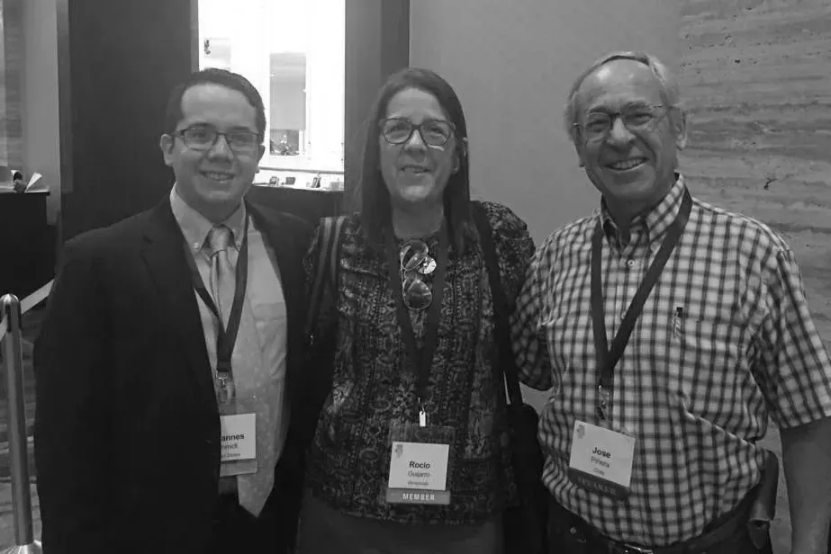 Johannes with José Piñera and another conference attendee