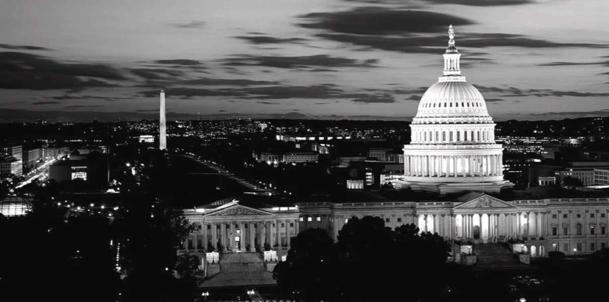 The U.S. Capitol dome and the Washington Monument lit at dusk