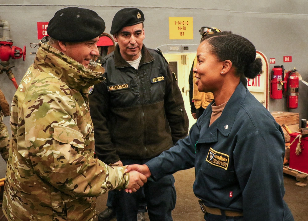 Chilean Vice Adm. Claudio Maldonado meets U.S. Navy Cmdr. Carla Salazar aboard USS Germantown
