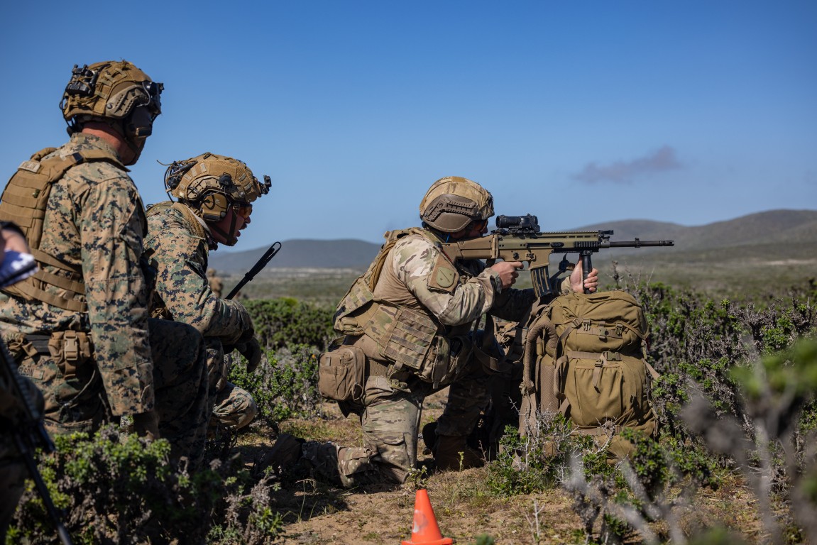 A U.S. Marine supervises a Chilean Marine during Exercise UNITAS at Puerto Aldea, Chile
